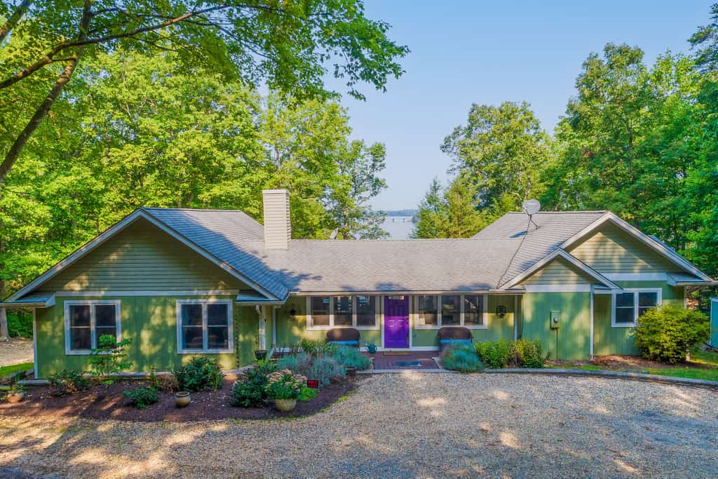Lakefront home with granite counters, fireplace, lake views, & dock