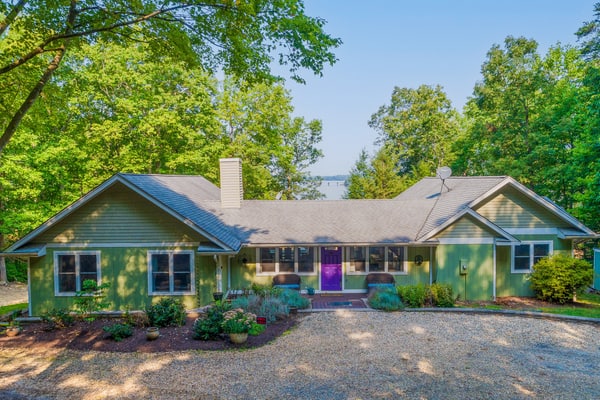 Lakefront home with granite counters, fireplace, lake views, & dock