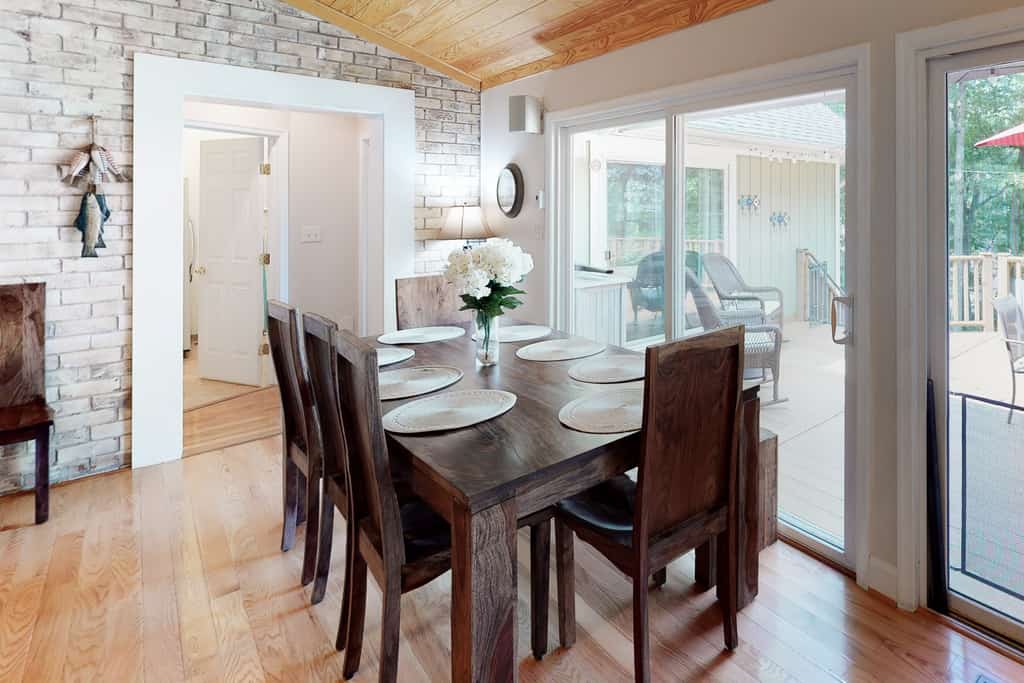 Lakefront home with luxurious finishes, granite counters, fireplace, lake views, foosball & dock