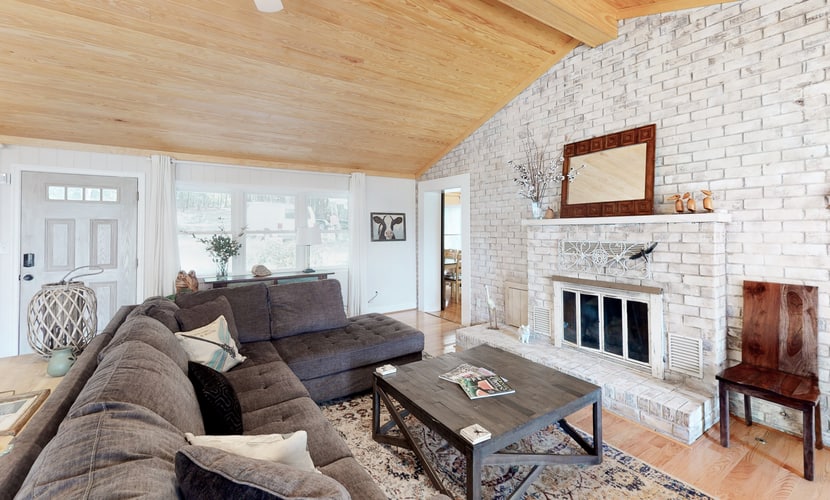 Lakefront home with luxurious finishes, granite counters, fireplace, lake views, foosball & dock