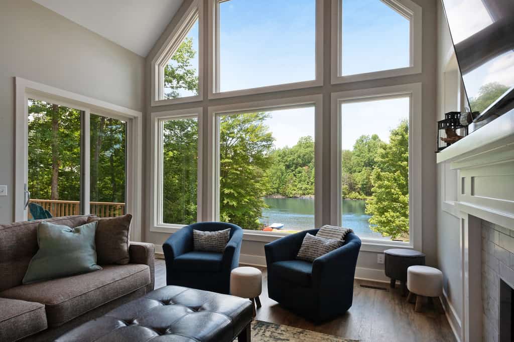 Custom lakefront home with private beach, dock & firepit