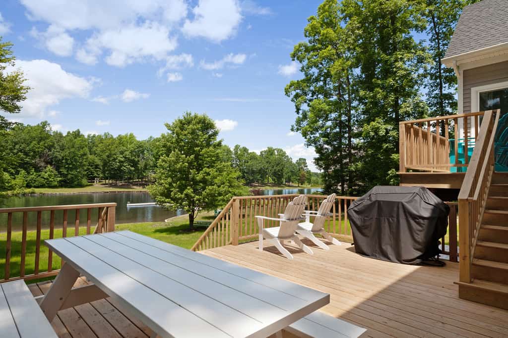 Custom lakefront home with private beach, dock & firepit