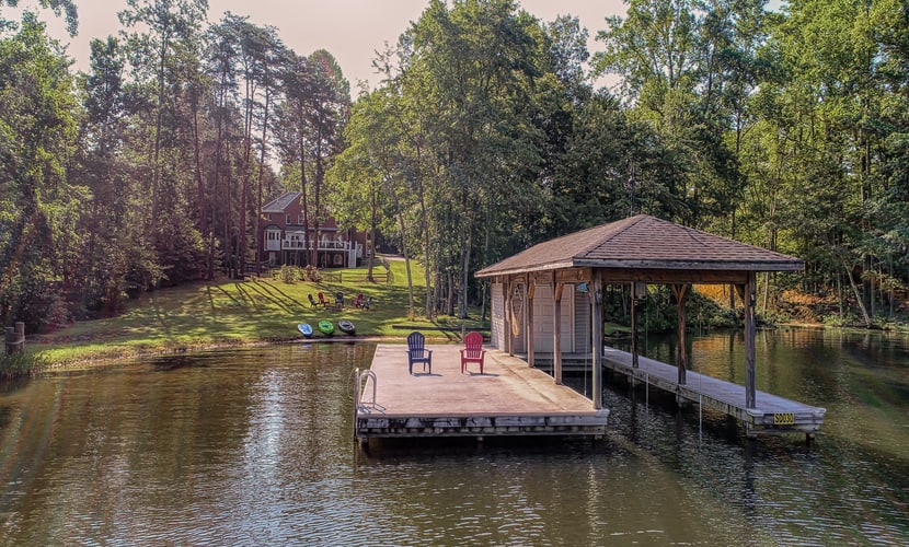 Lakefront home with boat dock, private firepit & game room - dog-friendly