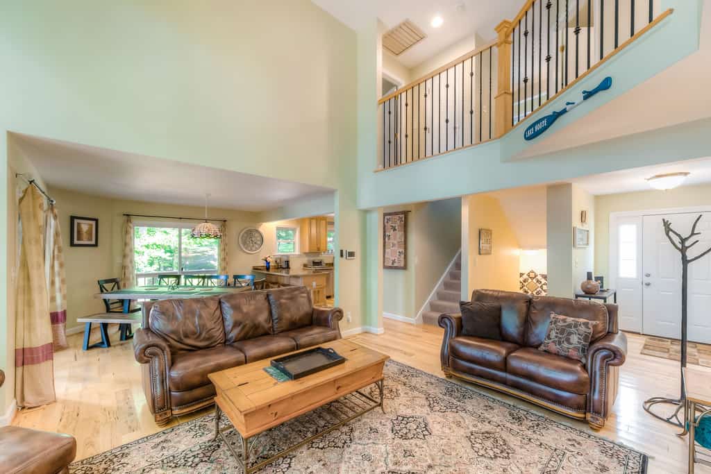 Spacious lake lodge with a private dock, wraparound decks & foosball