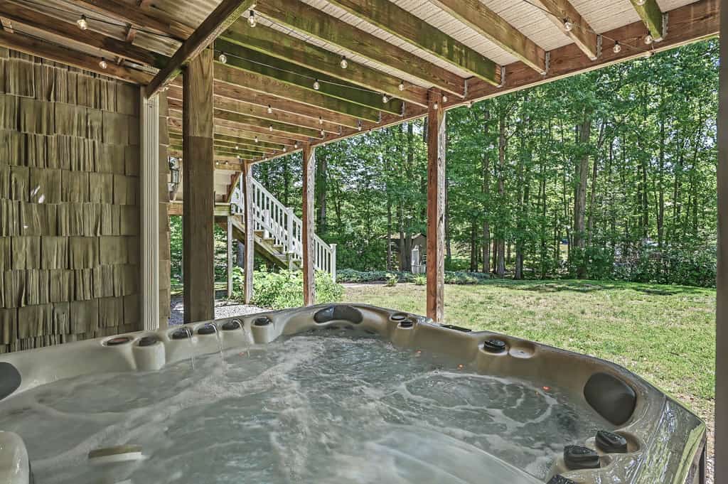 Stunning lakefront retreat w/firepit, game room, & water views