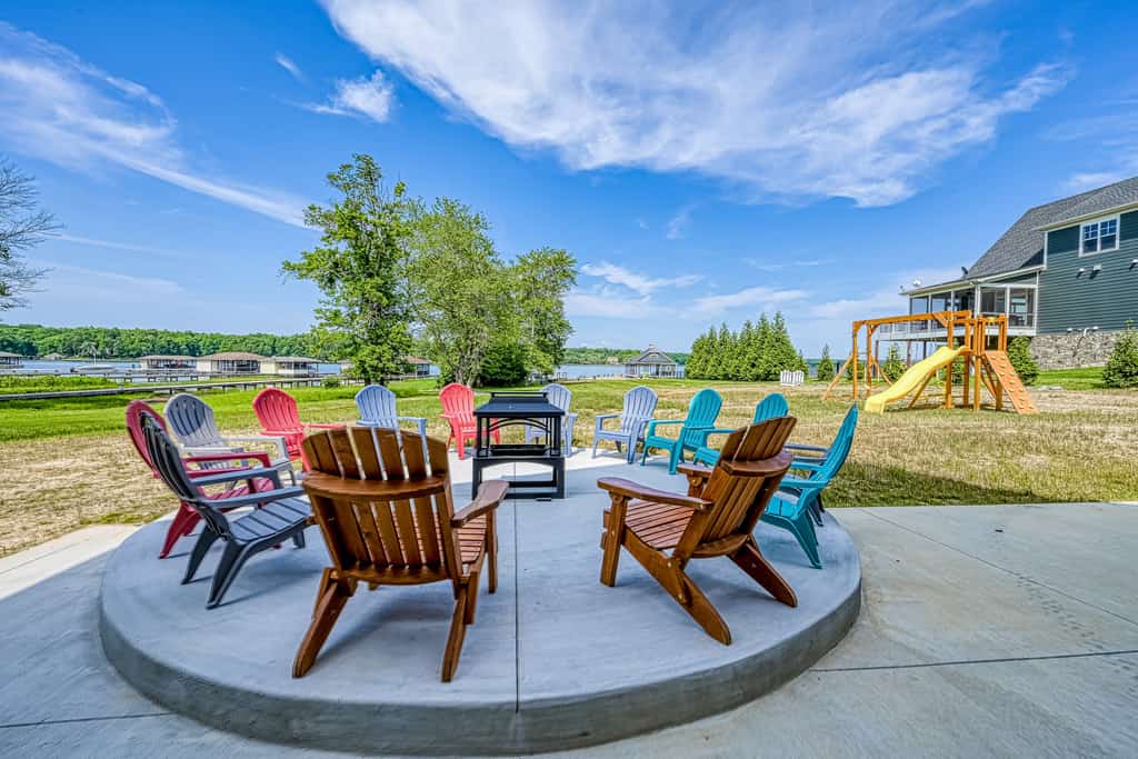 Dog-friendly lakefront home with a game room, children's items, and firepit