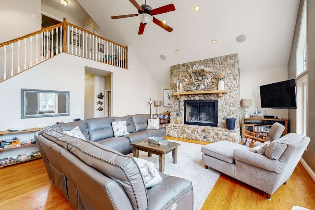 Nature lover's lakefront home with a beach, dock, fire ring, & more