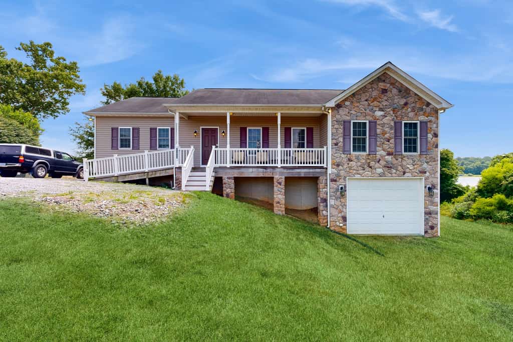 Two-story, lakefront getaway with dock, beach, grill, 2 kayaks, 2 canoes, AC