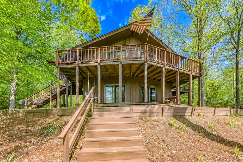 Serene lakefront home with free WiFi, private dock, game room, & central AC