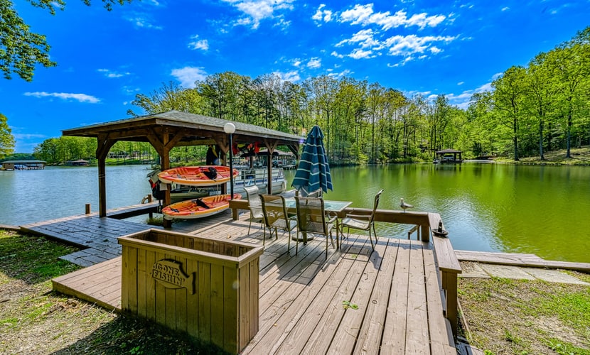 Serene lakefront home with free WiFi, private dock, game room, & central AC