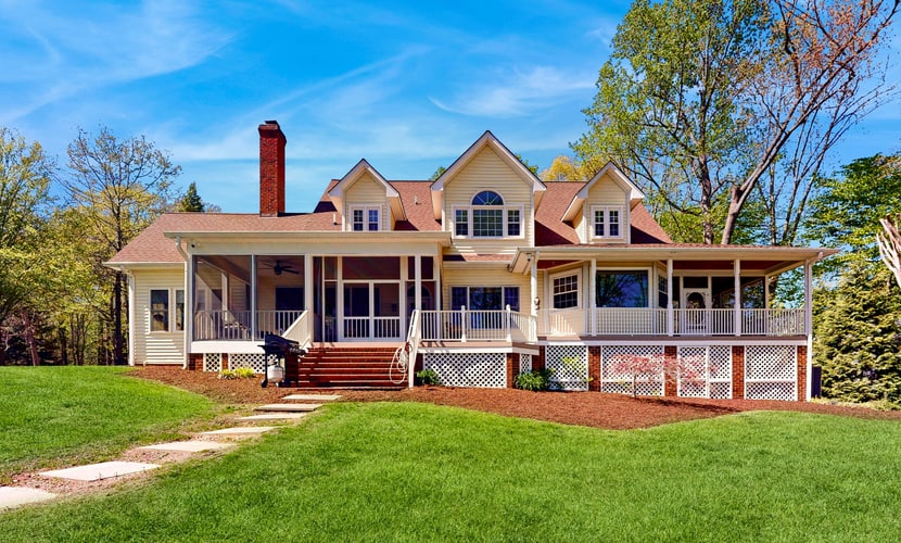 Lakefront home with private dock, kayaks, beach, badminton, firepit, & deck