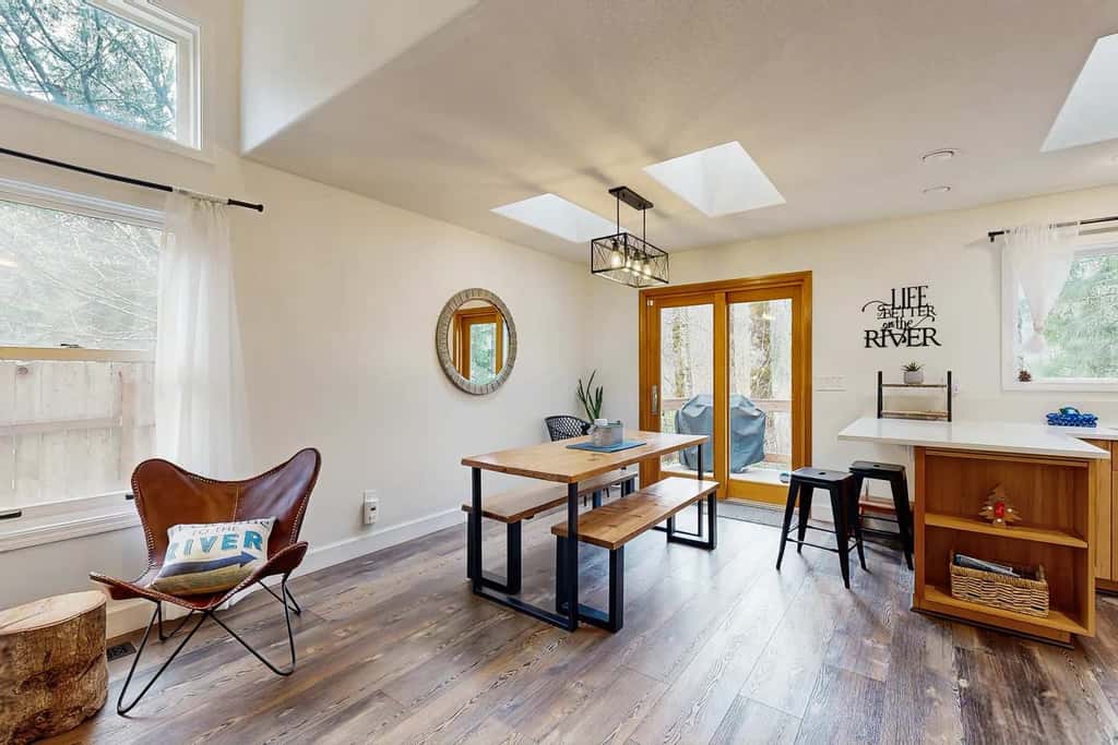 Riverfront retreat with panoramic river and forest views