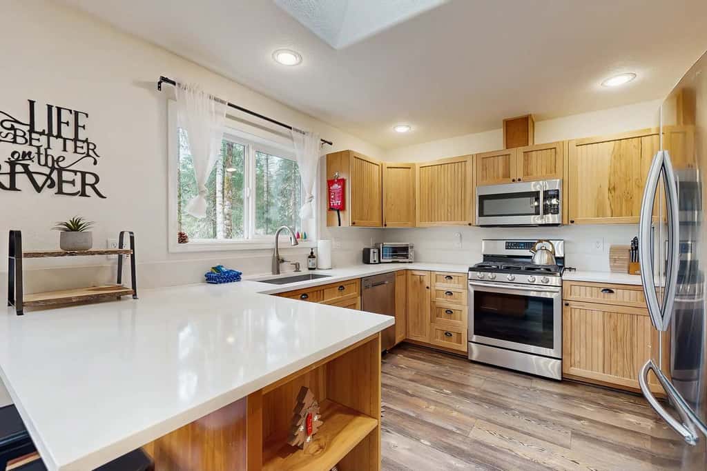 Riverfront retreat with panoramic river and forest views