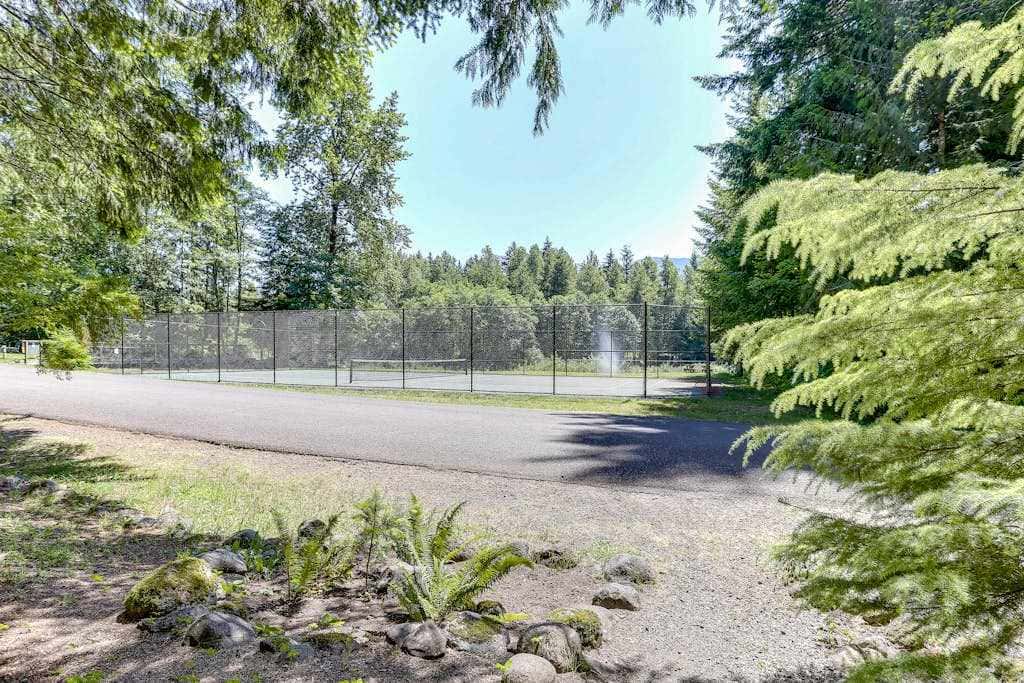 Riverfront retreat with panoramic river and forest views
