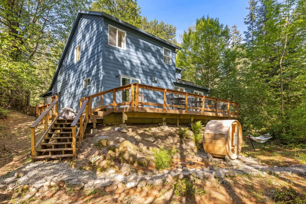 Riverfront retreat with panoramic river and forest views