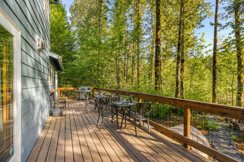 Riverfront retreat with panoramic river and forest views
