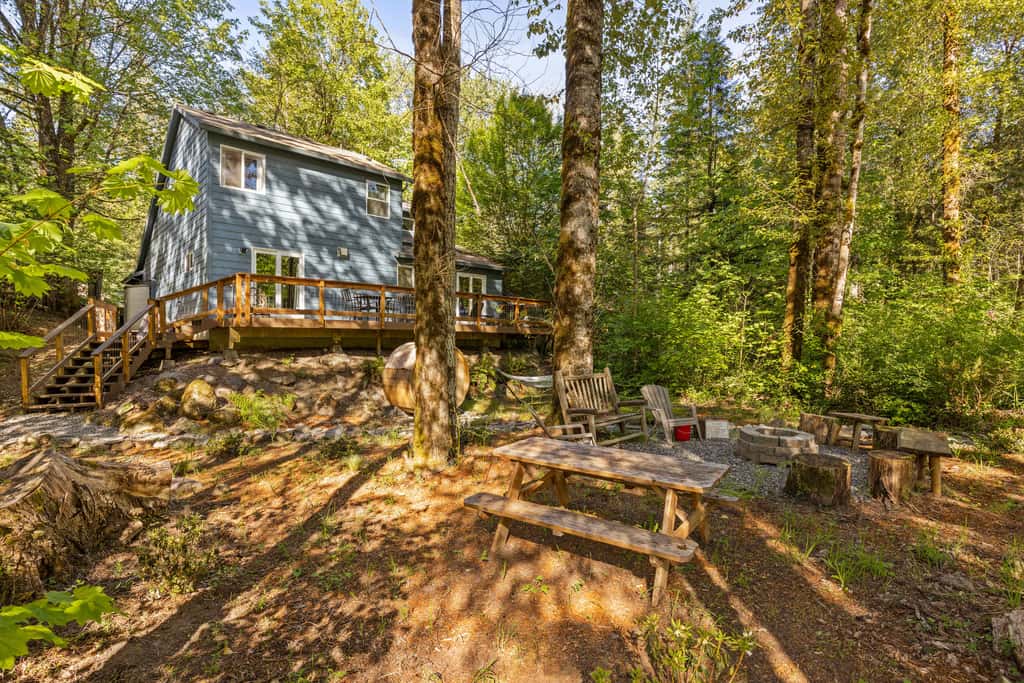 Riverfront retreat with panoramic river and forest views
