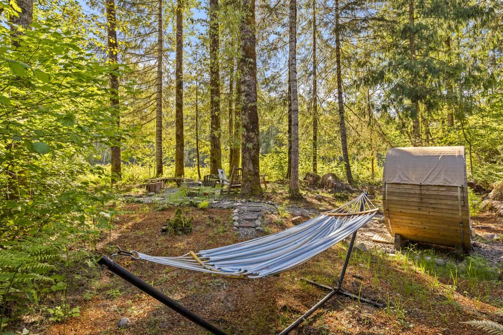 Riverfront retreat with panoramic river and forest views