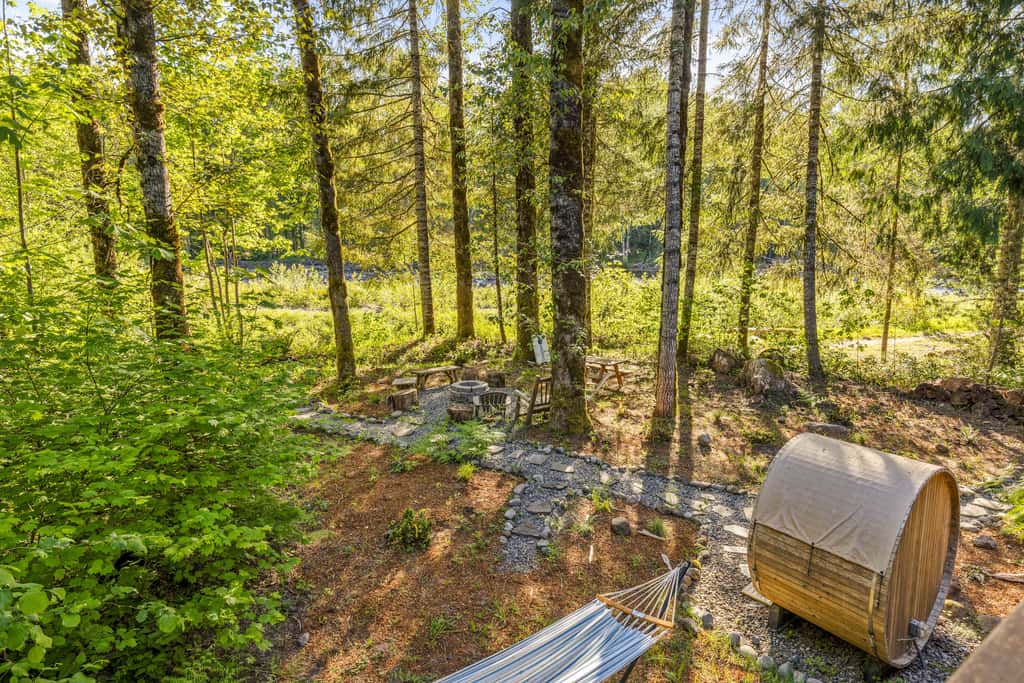 Riverfront retreat with panoramic river and forest views