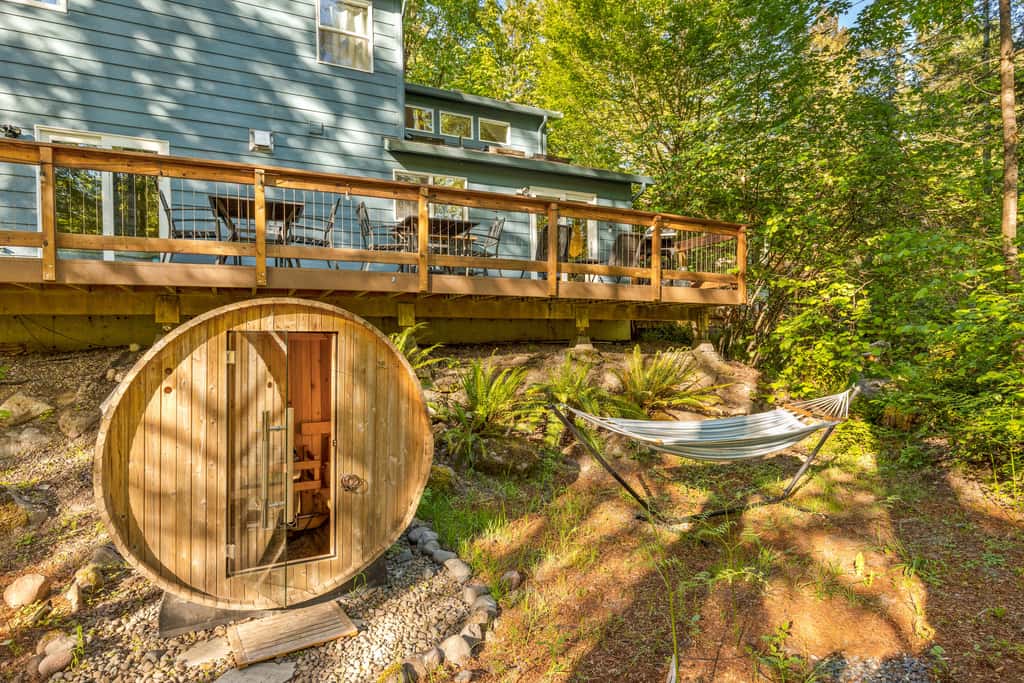 Riverfront retreat with panoramic river and forest views