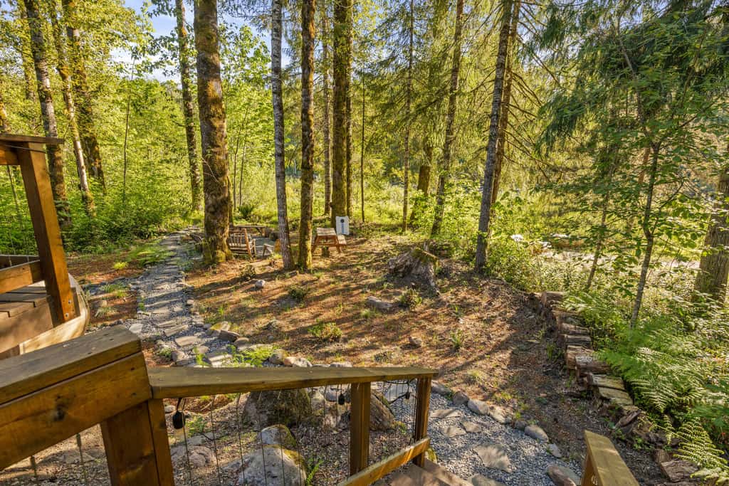 Riverfront retreat with panoramic river and forest views