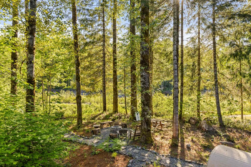 Riverfront retreat with panoramic river and forest views