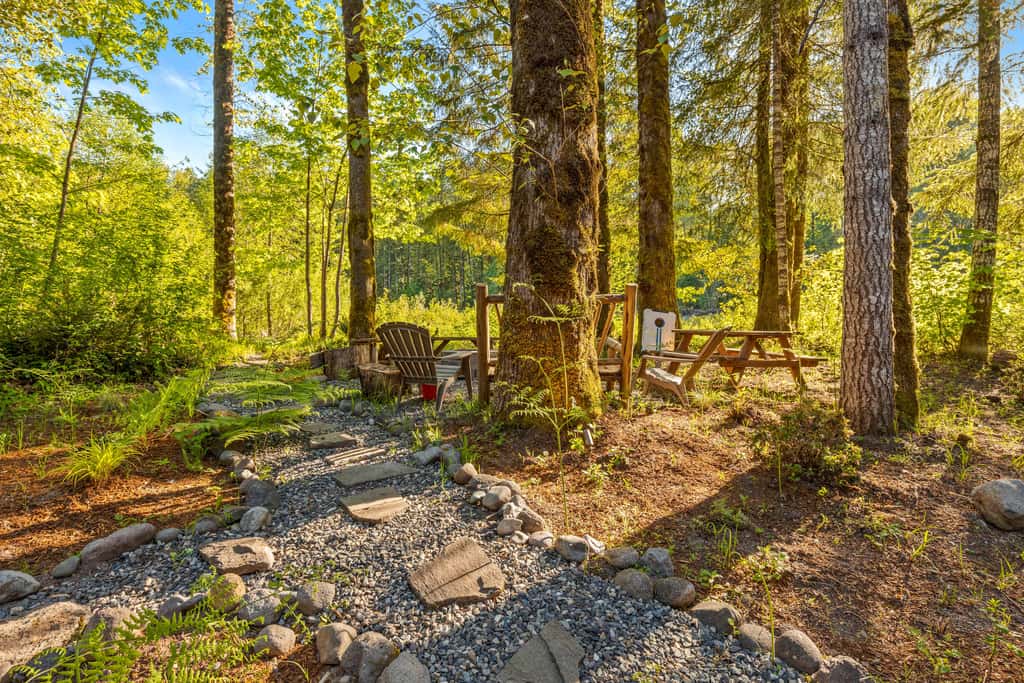 Riverfront retreat with panoramic river and forest views