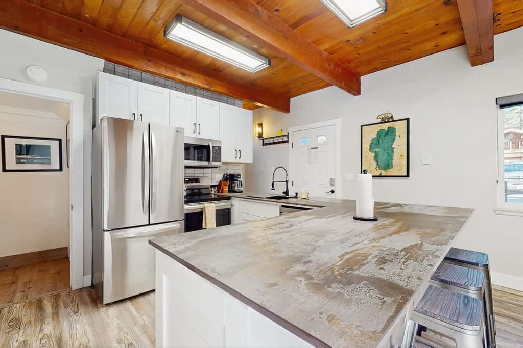 Rustic-modern Kings Beach cabin with fire pit, BBQ decks, and a private yard—perfect for year-round Tahoe getaways!