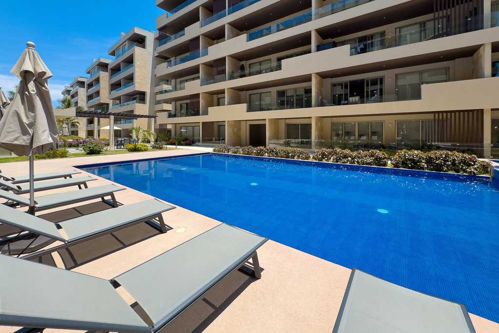 Elegant resort condo with heated pool, pickleball, gym & garden views