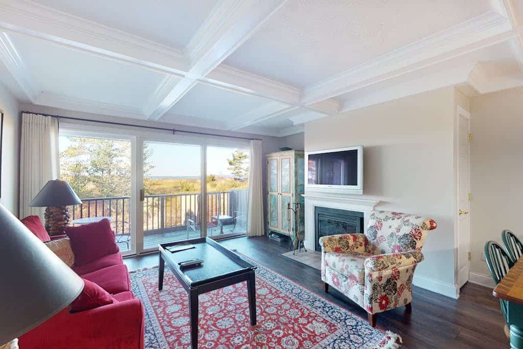 Riverfront condo with beach access to lake, fireplace, furnished deck & cable