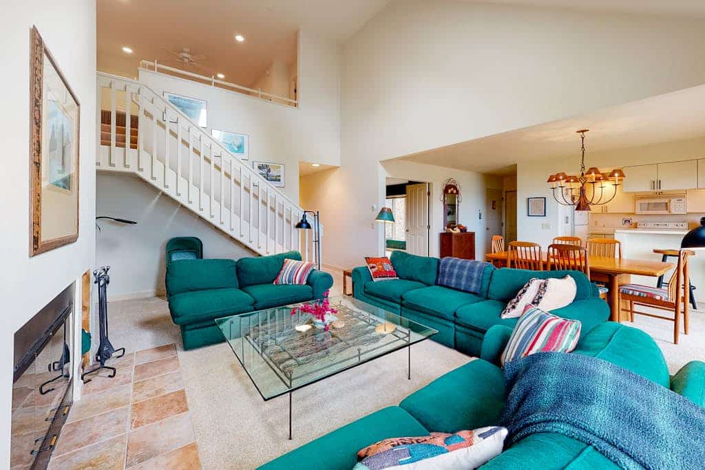 Beachfront condo with sunset & lake views, fireplace, washer/dryer