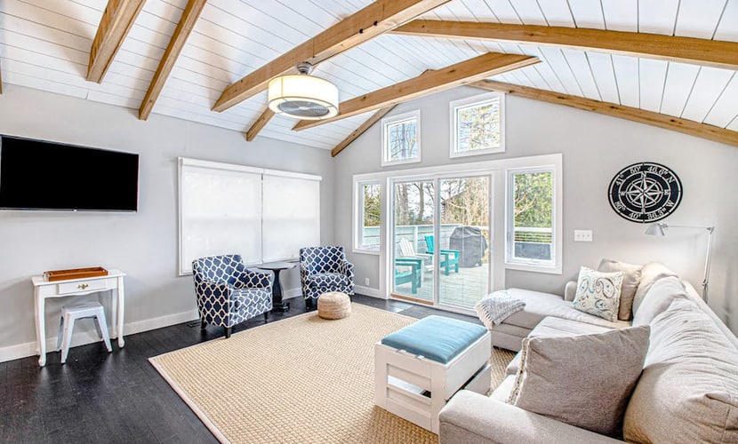 Fully-renovated lakefront home with beach cabana, association beach, & firepit