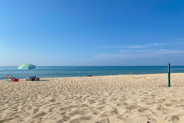 Fully-renovated lakefront home with beach cabana, association beach, & firepit