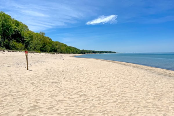 Fully-renovated lakefront home with beach cabana, association beach, & firepit