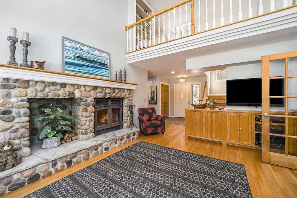 Spacious home with studio, lake access, sunroom, fireplace, W/D, & central AC
