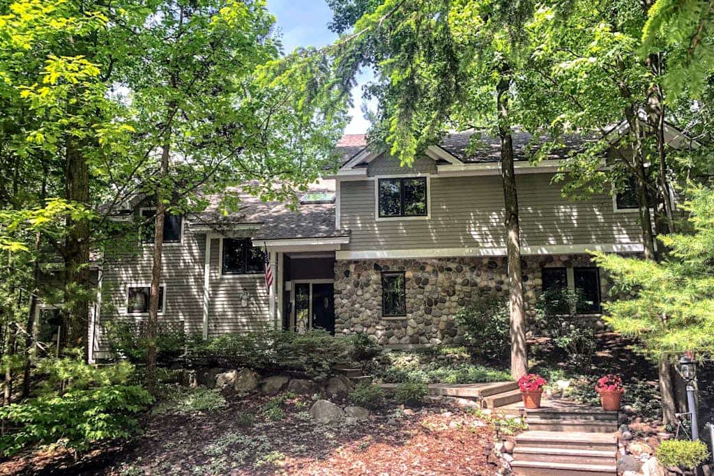 Spacious home with studio, lake access, sunroom, fireplace, W/D, & central AC