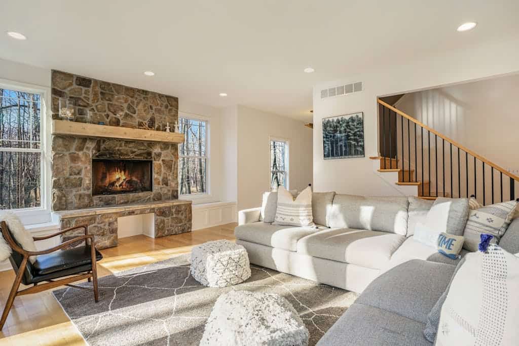 Modern Lake Michigan home with wood fireplace, open layout, deck, W/D, & AC