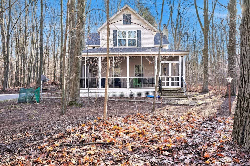 Modern Lake Michigan home with wood fireplace, open layout, deck, W/D, & AC