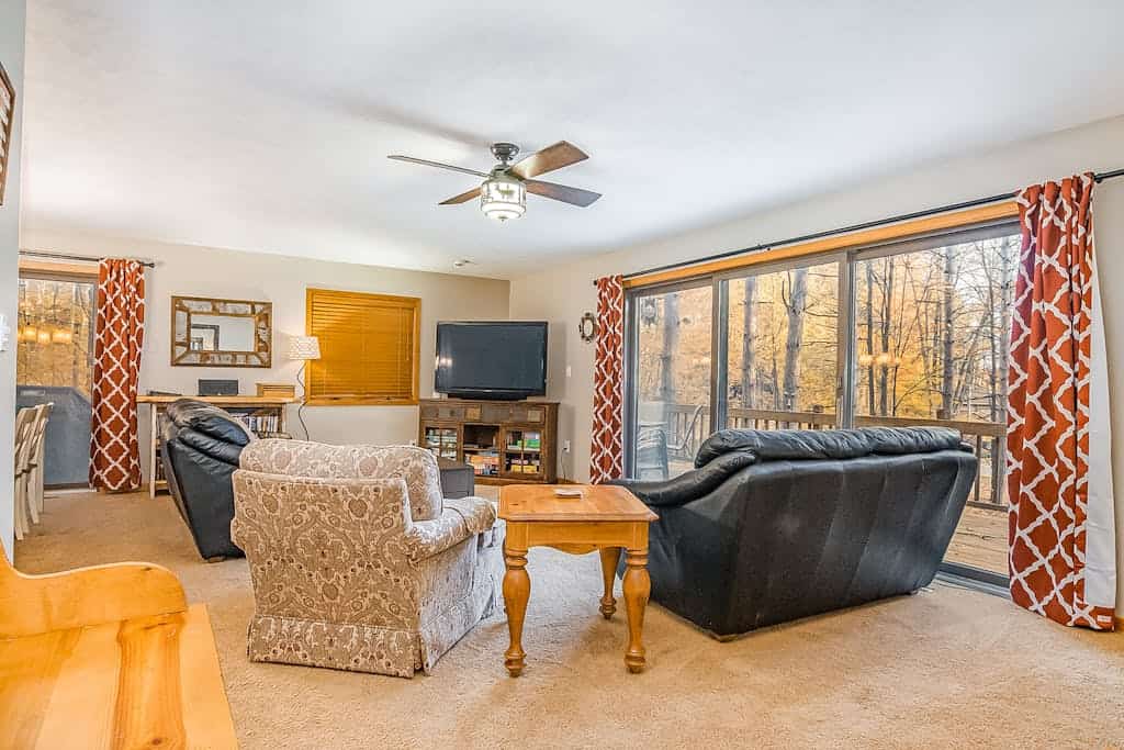 Stunning two-story home in the trees w/ a firepit, furnished deck, & balcony