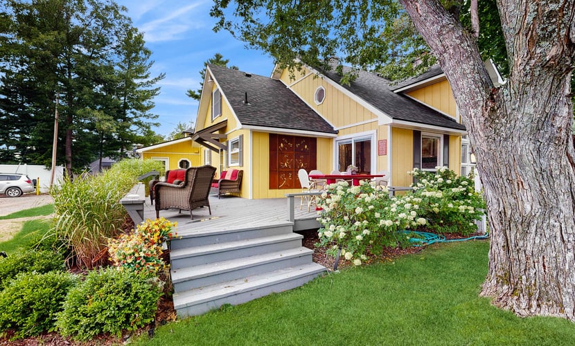 Cottage on the canal to Burt Lake with large patio and space for boat