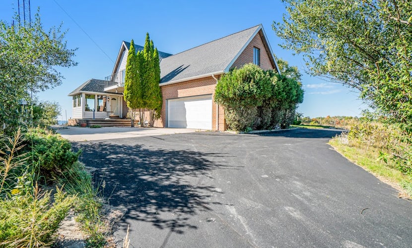 Dog-friendly, lake view home with three season room, fireplace, video projector