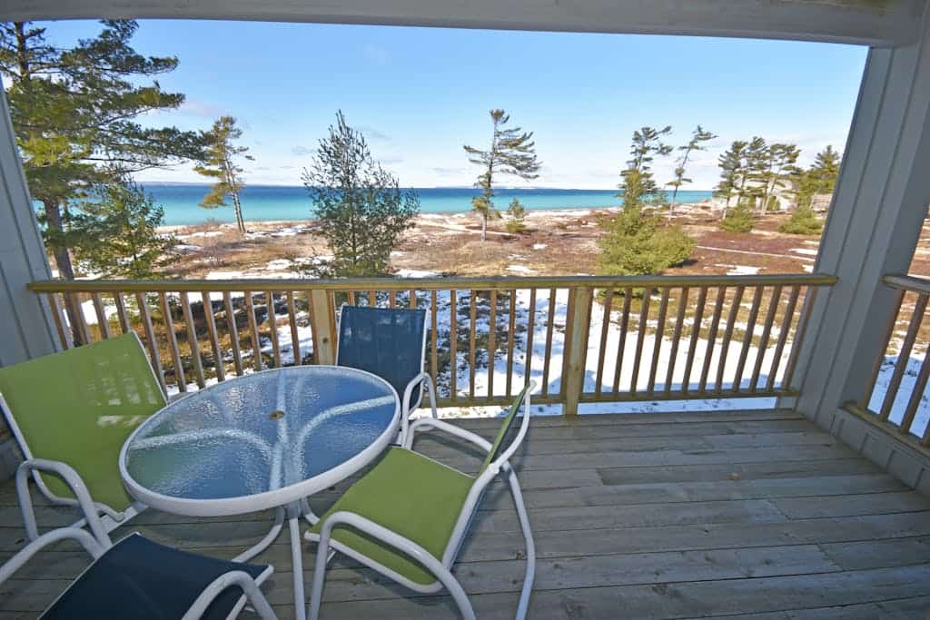 Beachfront condo with gorgeous Lake Michigan views, deck, fireplace, W/D, AC