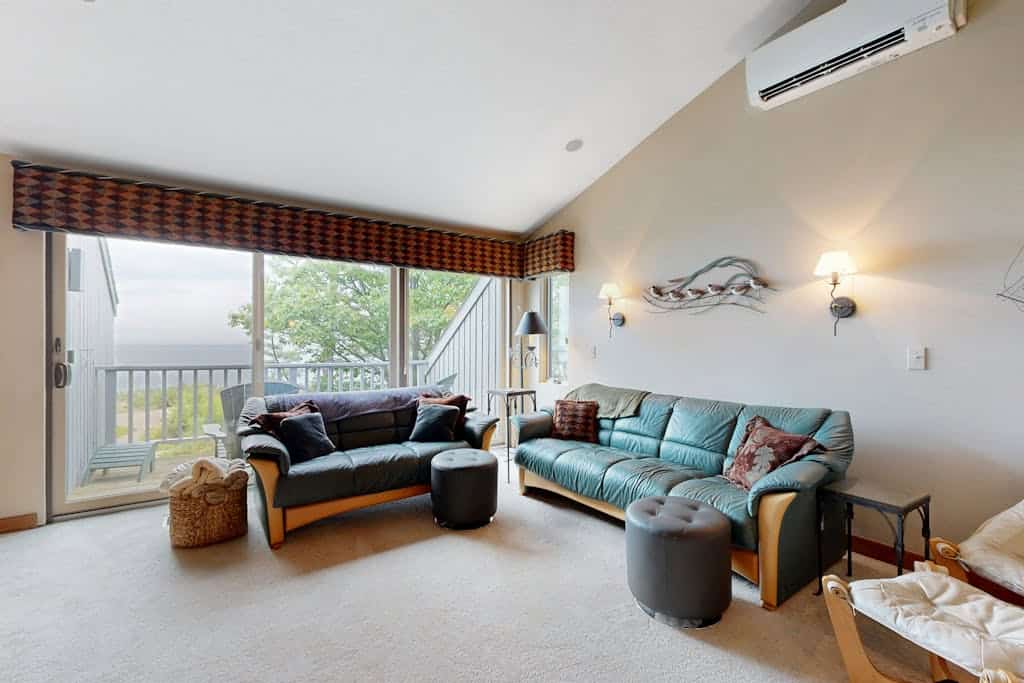 Lakefront condo with deck, gorgeous view, fireplace, & W/D
