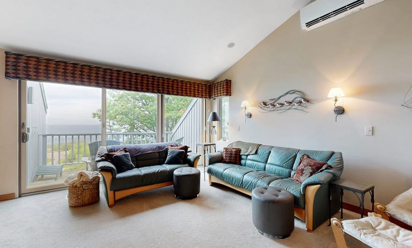 Lakefront condo with deck, gorgeous view, fireplace, & W/D