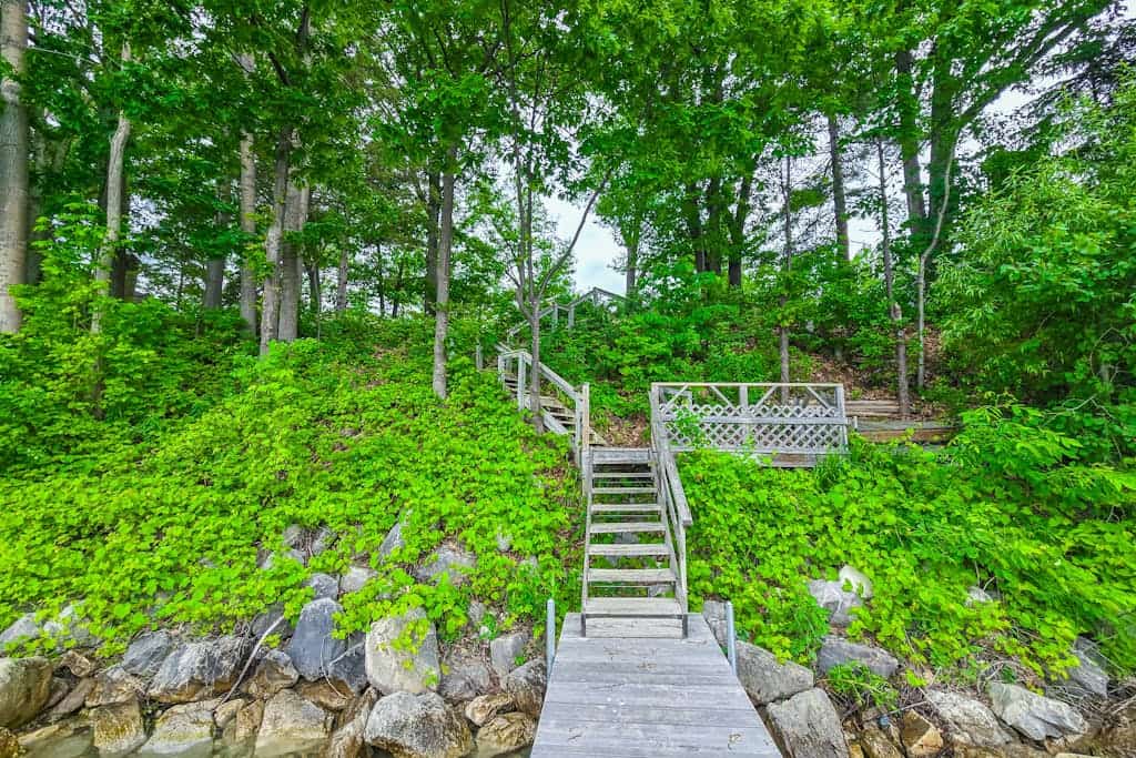 Charming lakefront cottage with large yard, dock, & fire pit - close to downtown