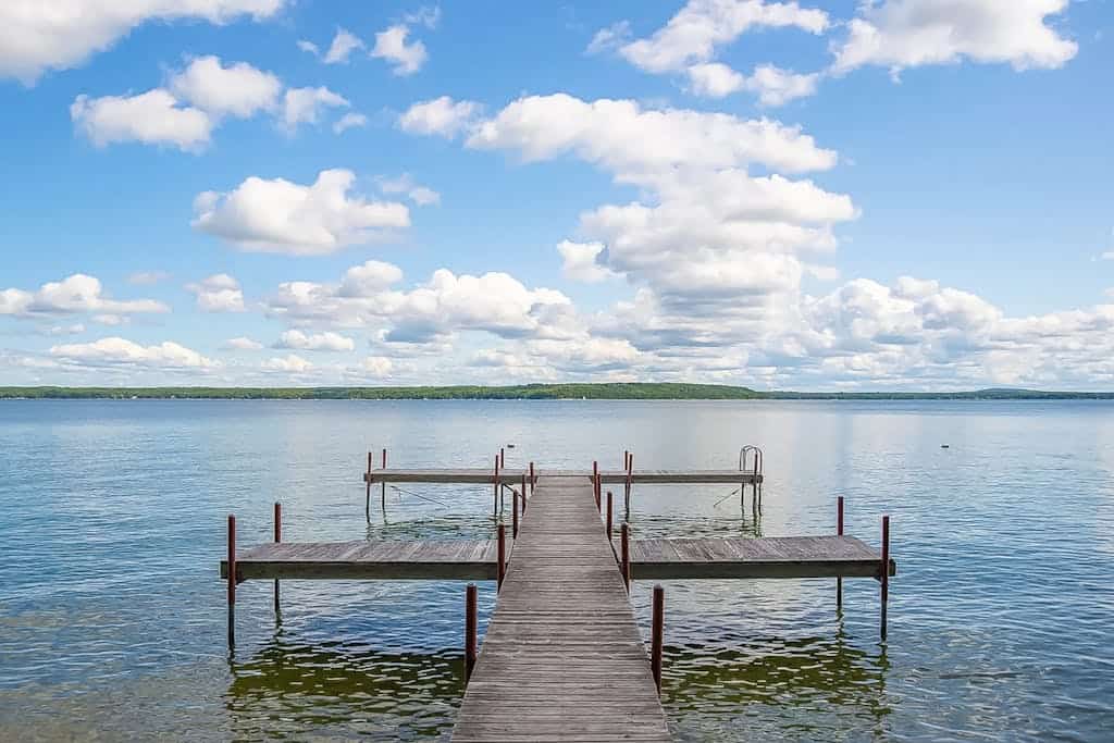 Charming lakefront cottage with large yard, dock, & fire pit - close to downtown