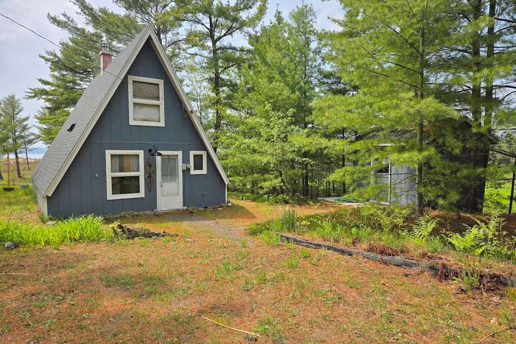 Rustic A-Frame Retreat on Grand Traverse Bay w/ beach, wifi, fire pit & grill