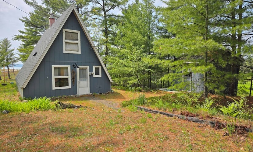 Rustic A-Frame Retreat on Grand Traverse Bay w/ beach, wifi, fire pit & grill