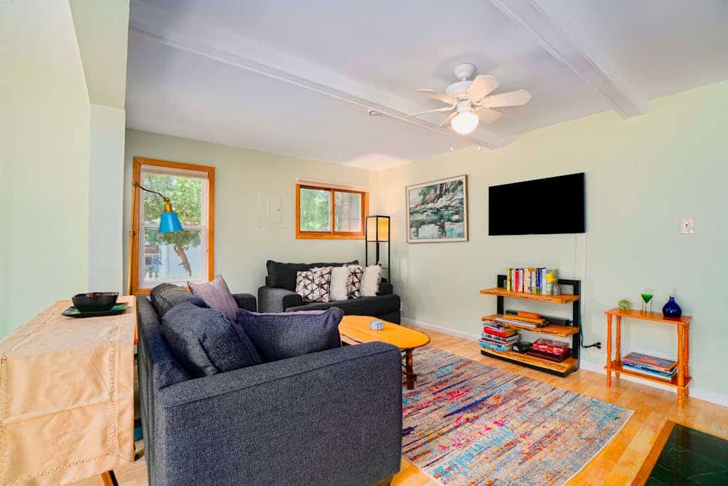 Dog-friendly cottage with fenced yard, firepit, W/D, & WiFi - walkable location