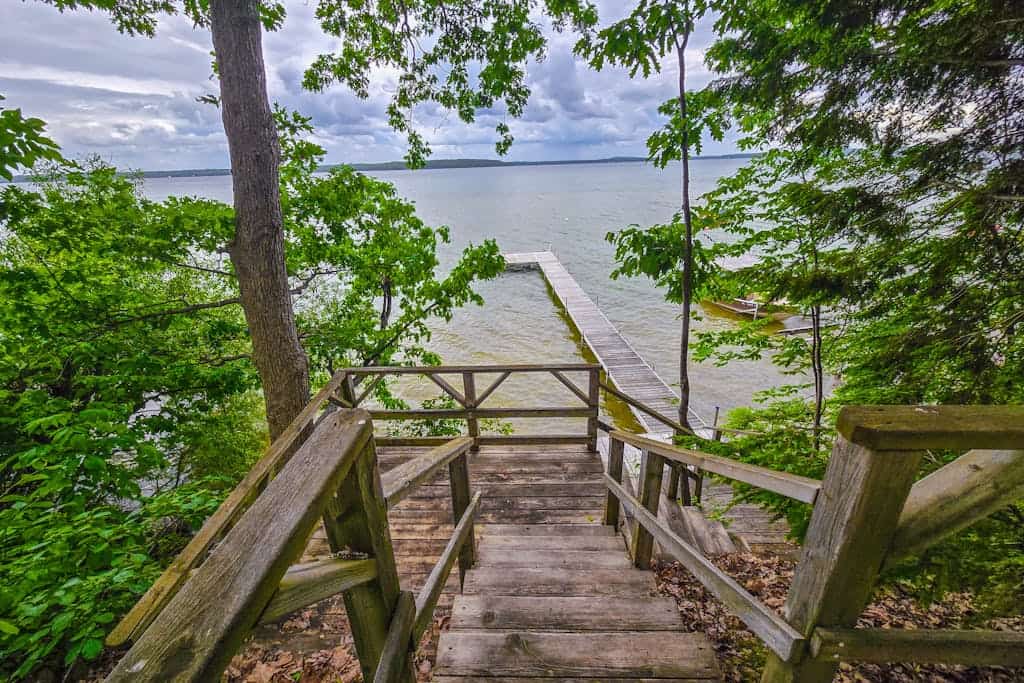 Incredible lakefront retreat with dock, fire pit, decks, yard, & amazing views